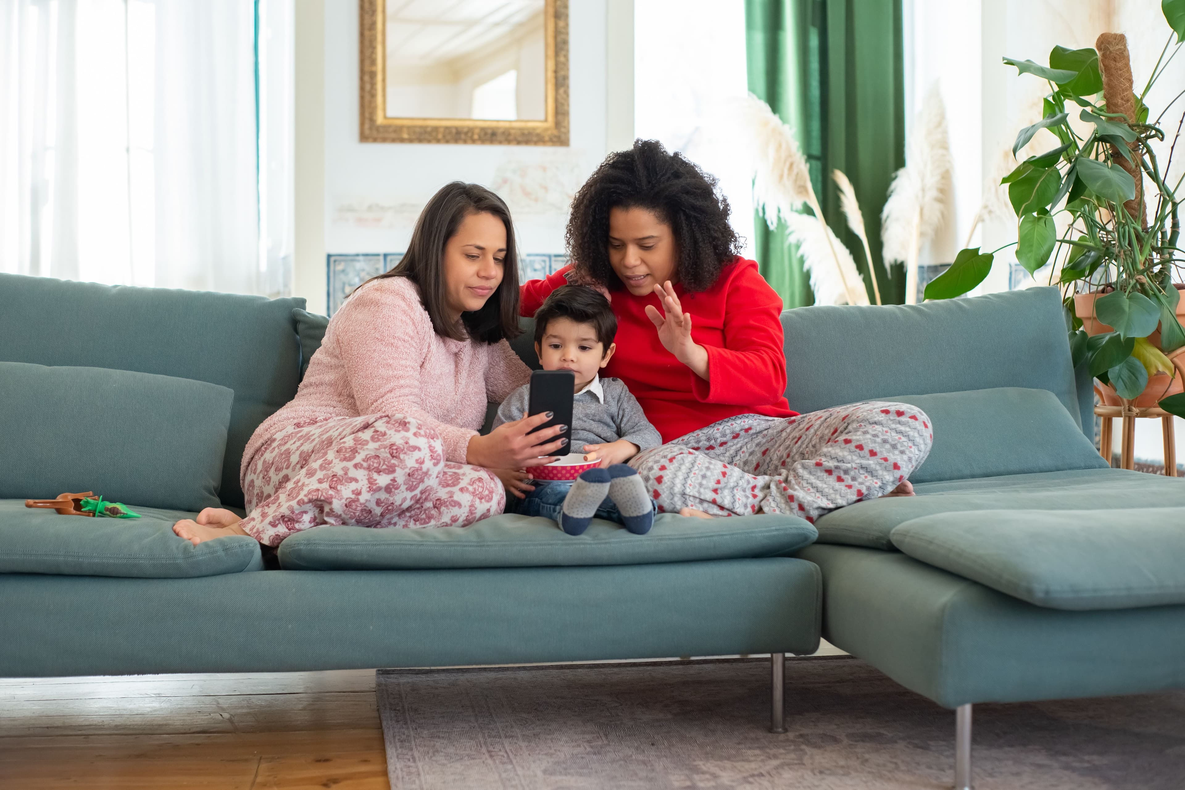 An LGBTQ+ family relaxing together at home