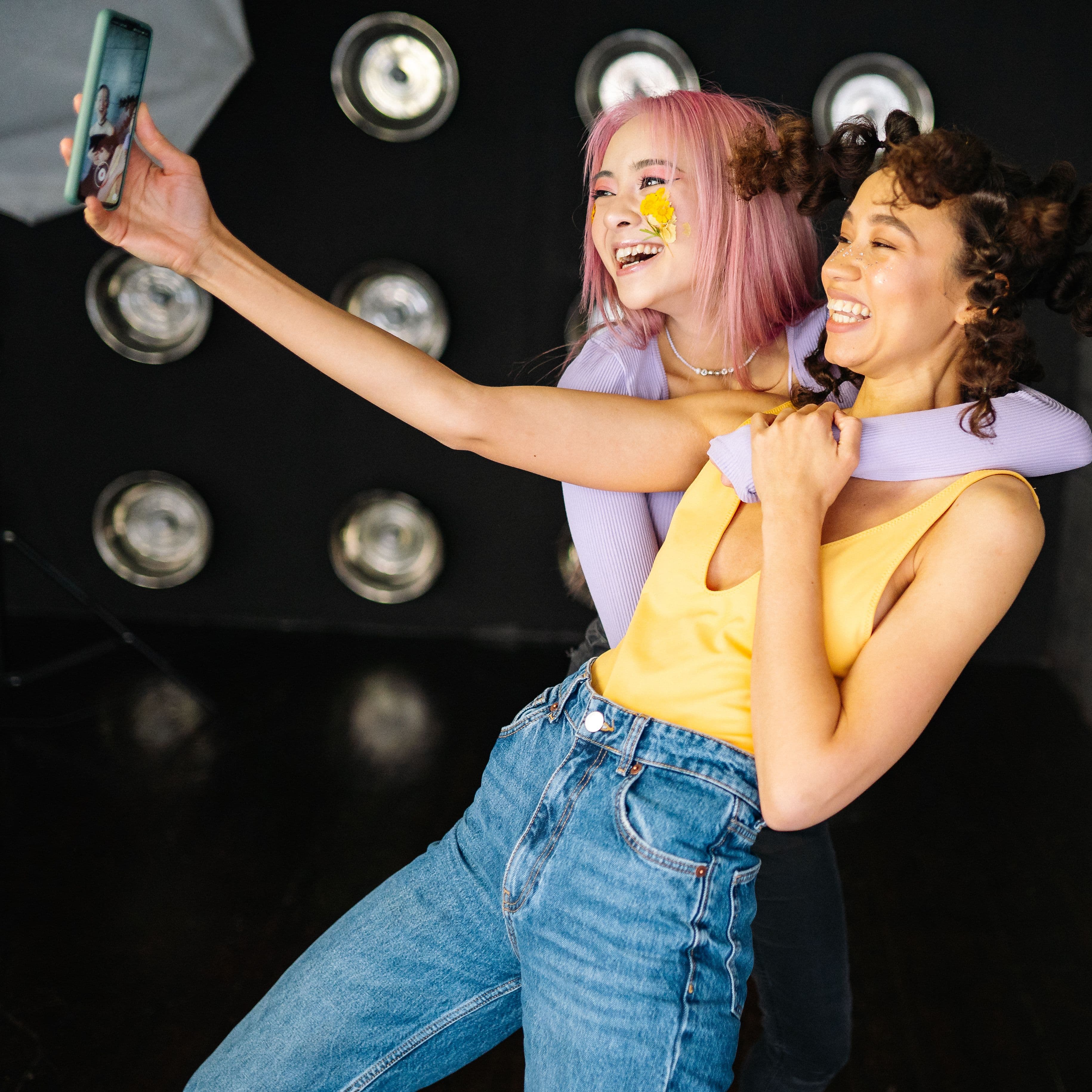 Two friends laughing together over coffee